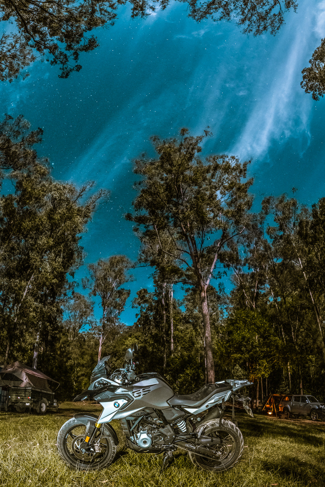 BMW G310GS photographed with a starry sky in the background. Photography by Joseph Byford while camping in Cononldale National Park