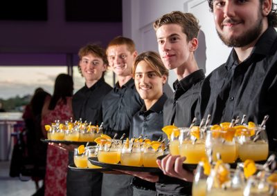 Waters Edge event at porstide waiters holding drinks